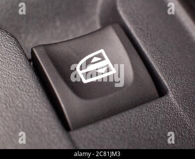 Power window button in a modern car, background, closeup, macro Stock Photo