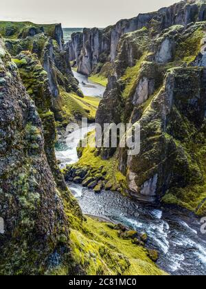 Fjadrargljufur is a magnificent and massive canyon, about 100 meters deep and about two kilometres long. The canyon has sheer walls Stock Photo