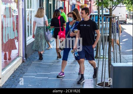 Clonakilty, West Cork, Ireland. 20th July, 2020. Today was the first day of mandatory face mask wearing in shops and stores, due to the increase in cases of Covid-19. Many shoppers in Clonakilty wore masks, and equally, many didn't. Credit: AG News/Alamy Live News Stock Photo