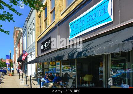 People enjoy outside seating for smoking at some trendy shops on the town square in historic Murfreesboro, TN, Stock Photo