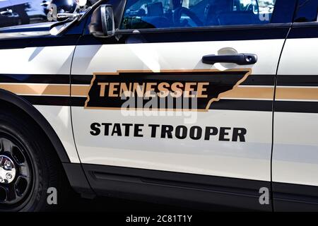 Close up of the driver door of a Tennessee State Trooper patrol car, with the graphic design outline  of the state of TN Stock Photo