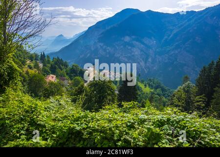 Pergine Valsugana, Italy - August 12, 2019: Village under mountain range and small town in valle of Italian Alps, Trentino Alto Adige, Trento Province Stock Photo