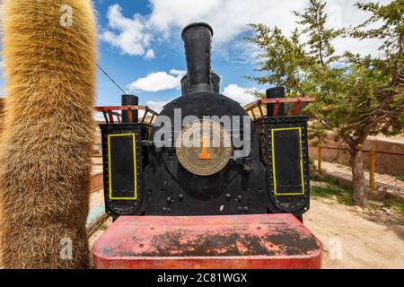 Baldwin locomotive 14301, built in 1895, partially restored and plinthed above mine entrance; Pulacayo, Potosi Department, Bolivia