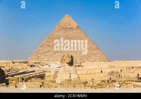 Great Sphinx of Giza, Pyramid of Khafre (background), Giza Pyramid Complex, UNESCO World Heritage Site; Giza, Egypt Stock Photo