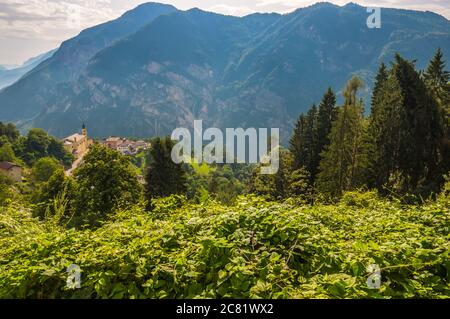 Pergine Valsugana, Italy - August 12, 2019: Village under mountain range and small town in valle of Italian Alps, Trentino Alto Adige, Trento Province Stock Photo