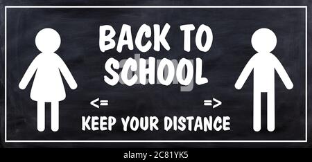 BACK TO SCHOOL KEEP YOUR DISTANCE text message against black background, banner. Coronavirus spread in school prevention measure sign Stock Photo