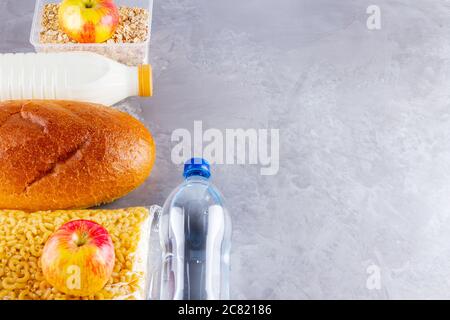 Food donations on a gray background. Food supplies. Set of food products. Top view. Copy space Stock Photo