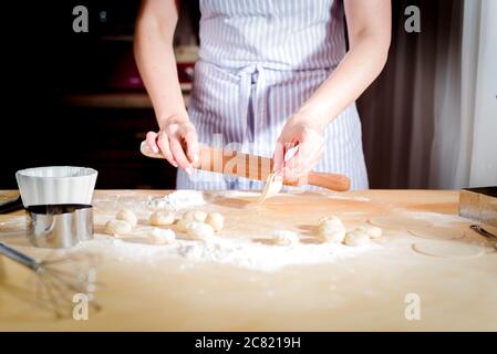 fingers on dough, chef kneads dough for baking, concept cooking, bakery Stock Photo