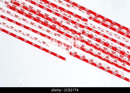 Drinking straws for party on white background. Top view of colorful paper straws for cocktails. Place for text, copy space. Stock Photo