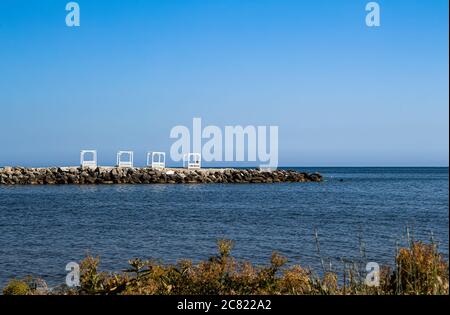 View of the stone beach and a small Bay of huge boulders. Beautiful seascape, nature and a great place for tourists. The resort city of Gelendzhik Stock Photo