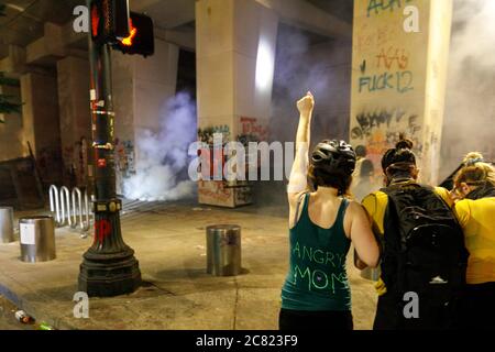 Portland, USA. 19th July, 2020. Protesters dismantle a fence at ...