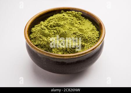 Herbal henna or Mehandi powder in a bowl forming heap, Used for Tattoo or Hair Dye in India Stock Photo