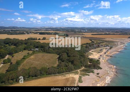 Aerial View along the West Sussex coastline towards Climping on a warm and sunny summers day. Stock Photo