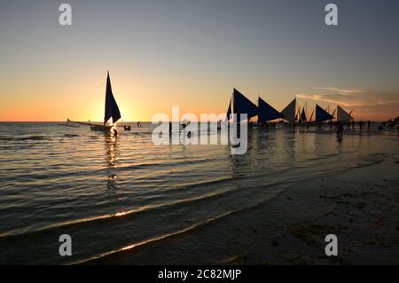 Sailboats silhouette at sunset. White Beach. Boracay. Western Visayas. Philippines Stock Photo