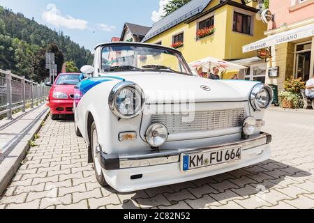 HRENSKO, CZECH REP - JULY 19, 2020. Historic Trabant car modified as a cabriolet. White-blue trabant on a sunny day in Hrensko, Czech Republic. Stock Photo
