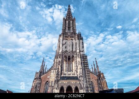 Ulm Minster or Cathedral of Ulm city, Germany. It is top landmark of Ulm. Front view of famous medieval Christian church of Ulm, amazing facade of old Stock Photo