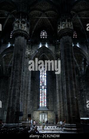 Milan, Italy - May 16, 2017: People inside old Milan Cathedral or Duomo di Milano. It is great Catholic church, top landmark of Milan. Interior of lar Stock Photo