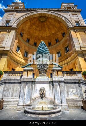 Fontana della Pigna or Pine Cone fountain in Belvedere courtyard of Vatican museums, Rome, Italy. It is landmark of Vatican City, detail of papal pala Stock Photo