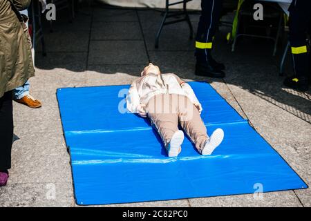 Fire and rescue duty training manikins dummy with rescue emergency team nearby during a general training for exceptional situations Stock Photo