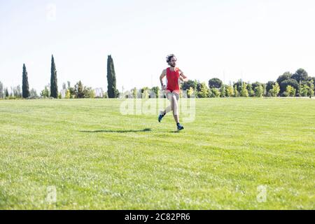 young man running in the city park Stock Photo