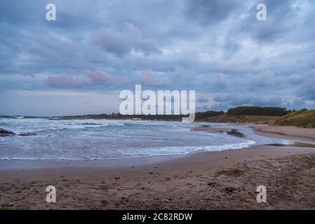 Morning storm clouds over beach on Caribbean Sea in summer Stock Photo