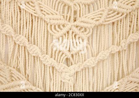 Macrame pattern. A minimal, stylish, trendy concept with a beautiful background with light neutral colors. Stock Photo