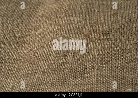 Fabric texture close up, rough brown canvas background, macro shot. Stock Photo