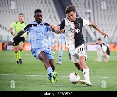 Turin, Italy. 20th July, 2020. FC Juventus' Paulo Dybala (R) vies with Lazio's Bastos during the Serie A football match in Turin, Italy, July 20, 2020. Credit: Federico Tardito/Xinhua/Alamy Live News Stock Photo