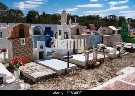 Colorful gravestones in a cemetery at Cacalchen, Yucatan, Mexico. Stock Photo