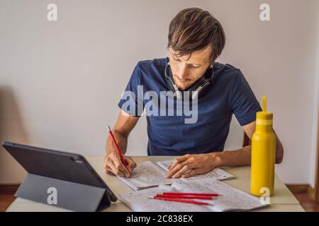 IELTS red pencils and essay notebook for the English exam Stock Photo -  Alamy