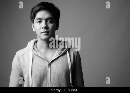 Portrait of young handsome Filipino man ready for gym Stock Photo