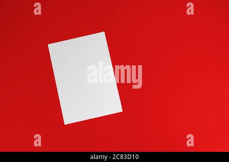 a blank empty white paper sheet of a4 format on the table in office, mockup copy space Stock Photo