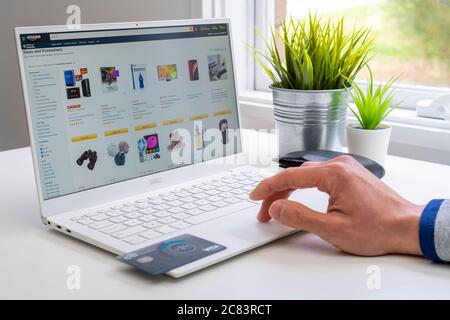 Browsing goods on Amazon online store Stock Photo