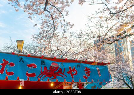 Osaka, Japan - CIRCA April, 2019 : Japanese street food stalls at Osaka castle cherry blossoms festival Stock Photo