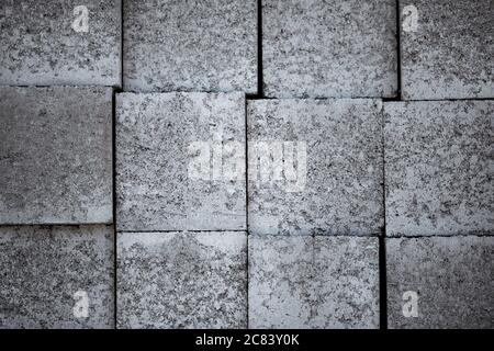 Background with grey construction blocks laying on each other. Stock Photo