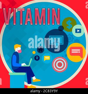 Handwriting text writing Vitamin. Conceptual photo organic molecule that is essential micronutrient that organism needs Man Sitting Down with Laptop o Stock Photo