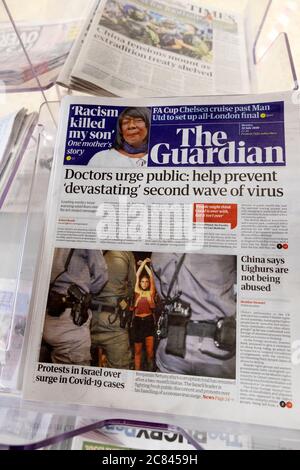'Doctors urge public: help prevent 'devastating' second wave of virus in The Guardian newspaper front page headline on 20 July 2020 London England UK Stock Photo
