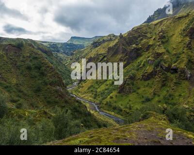 Landscape of Godland and thorsmork with rugged green moss covered rocks and hills, bending river canyon, Iceland, Fimmvorduhals hiking trail. Summer Stock Photo