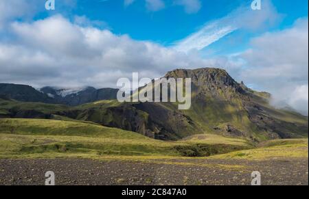 Panoramic breathtaking view on Landscape of Godland and thorsmork with rugged green moss covered hill and Eyjafjallajokull glacier, Iceland Stock Photo