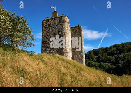 Union Jack flag flying from the turret of medieval stronghold Neidpath Castle near Peebles in the Scottish Borders Stock Photo