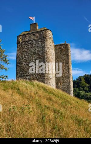 Union Jack flag flying from the turret of medieval stronghold Neidpath Castle near Peebles in the Scottish Borders Stock Photo