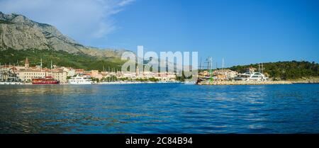 MAKARSKA, CROATIA - JUNE 17: Panoramic view of Makarska city center from the sea in Makarska, Croatia on June 17, 2019. Stock Photo