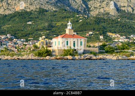 MAKARSKA, CROATIA - JUNE 17: Lighthouse on Makarska riviera beach in Makarska, Croatia on June 17, 2019. Stock Photo