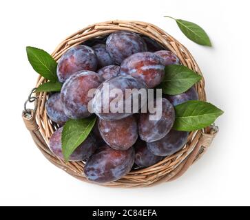 Fresh plums with leaves isolated on white Stock Photo