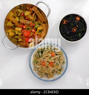 Top view daily meal, Vietnamese vegan food for vegetarian, tofu skin, pine apple and bitter melon cook with sauce, fried bamboo shoot, seaweed soup Stock Photo