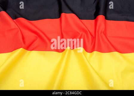 Natural fabric crumpled flag of Germany or German flag Stock Photo