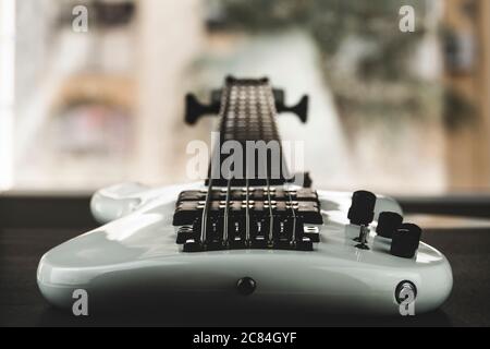 closeup of electrical bass guitar seeing at the back side Stock Photo