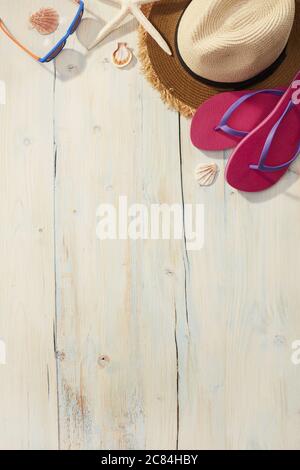 Beach items on a wooden background Stock Photo