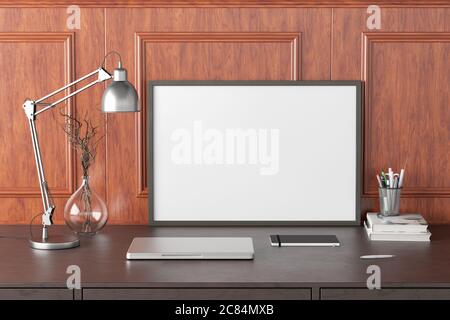 Horizontal poster frame mockup on the black table of home studio workspace with classic style decoration wall. Front view, clipping path around poster Stock Photo