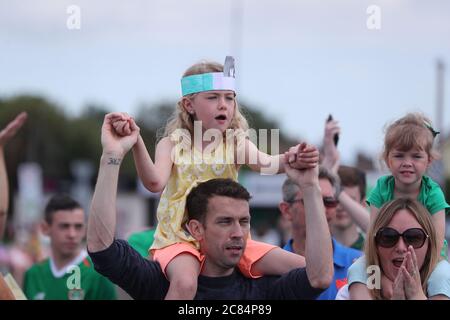 Irish football fans gather at Walkinstown Roundabout, Dublin to celebrate the life of former Republic of Ireland manager Jack Charlton at the same time of funeral in Newcastle. The World Cup winner, died on July 10 aged 85. Stock Photo